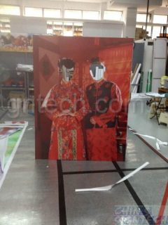 photo booth taking with cut out hole - Chinese wedding couples