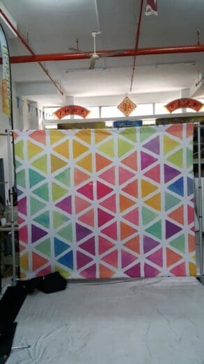 Portable backdrop with fabric banner for photo booth