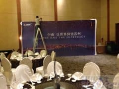 Installing pvc banner onto the backdrop frame