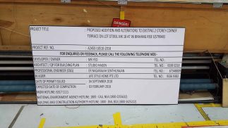 PVC banner on wooden board for construction site