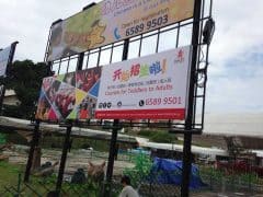 PVC banner wrap on Wooden Frame install on Banner structure