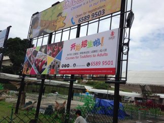 PVC banner wrap on Wooden Frame install on Banner structure